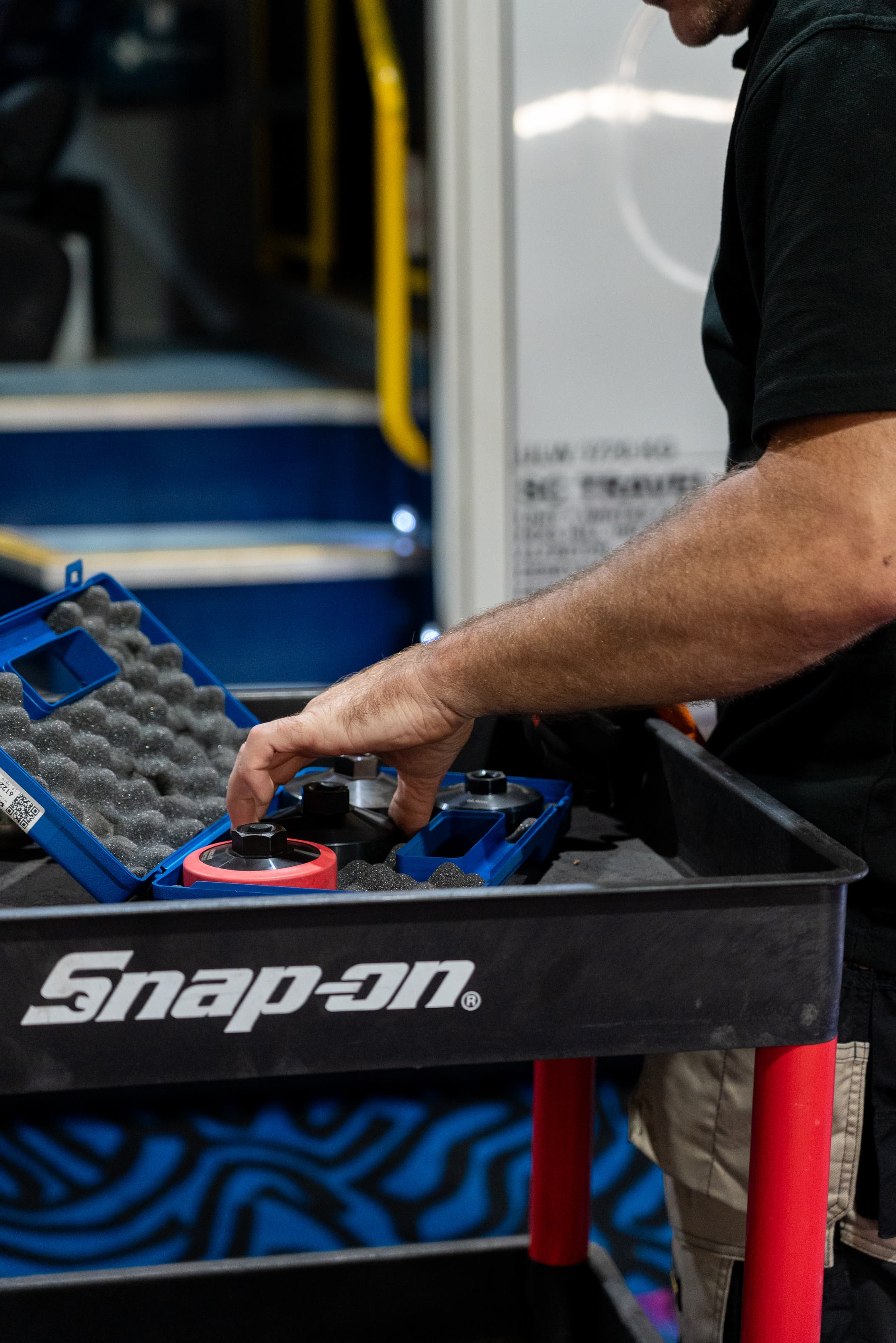 Air conditioning service couplers laid out on the workshop cart